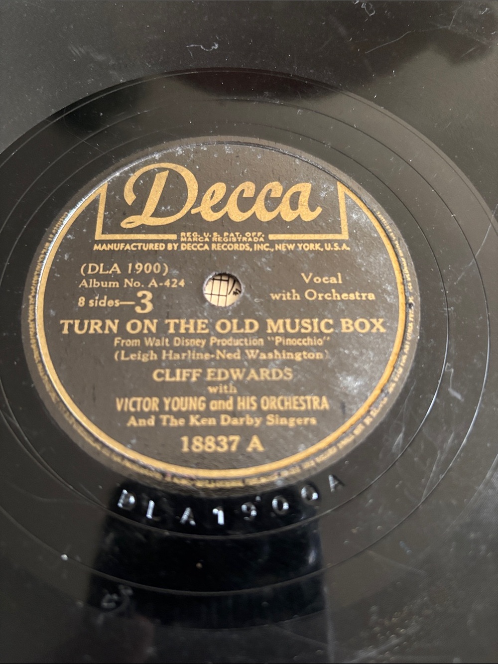 - "Turn On The Old Music Box" -little wooden head Disney's Pinocchio.
